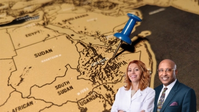 two people in front of map